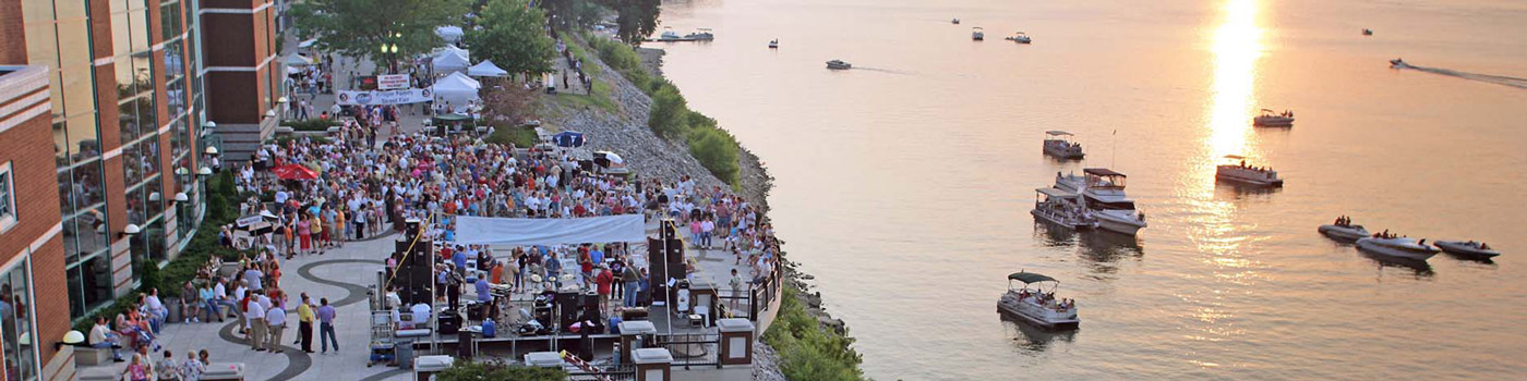 This is an image of a crowd gathering at a festival along the waterfront of Owensboro. ASTA-USA provides professional translation services in this city.