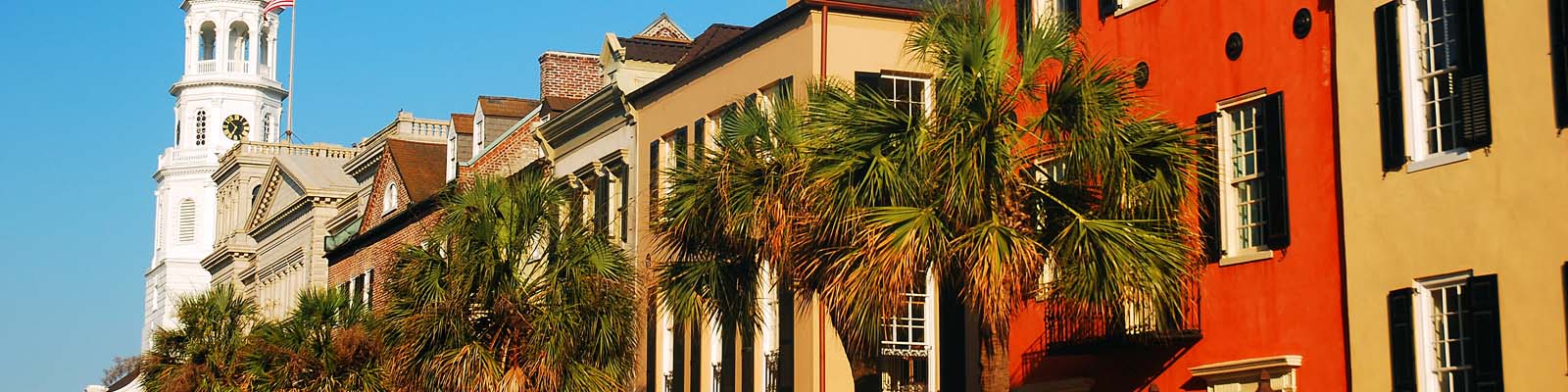 This is an image of colored buildings in downtown Charleston South Carolina where ASTA-USA provides professional translation services.