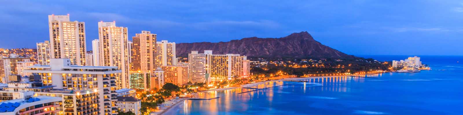 This is a coastal skyline of Honolulu at night. ASTA-USA provides professional translation services in this city.