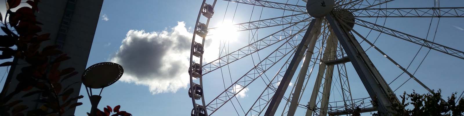 This is an image of a large ferris wheel in Manchester. ASTA-USA provides professional translation services in this city.